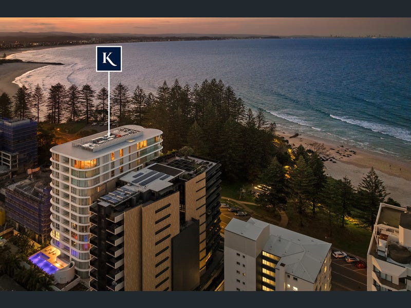Aerial over Coolangatta beach and the oceanfront building at sunset