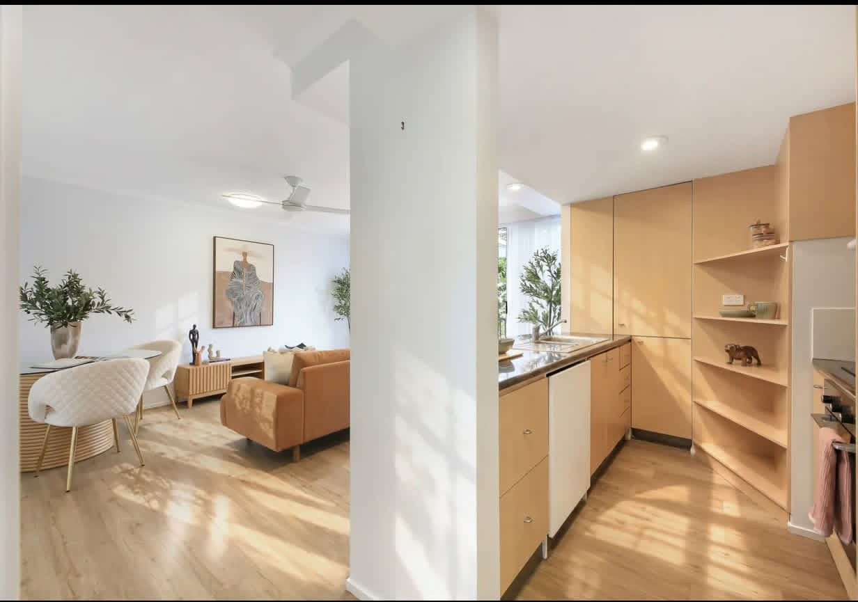 Kitchen and dining view with open shelving and styled benchtop