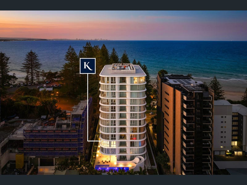 Dusk aerial of the curved oceanfront tower at Coolangatta