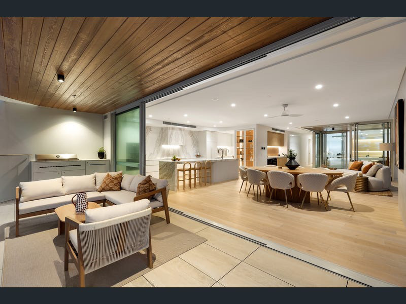 Outdoor terrace with BBQ kitchen opening onto the dining and living zones